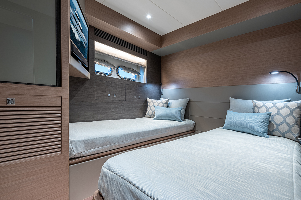 Convertible twin starboard stateroom with porthole. 