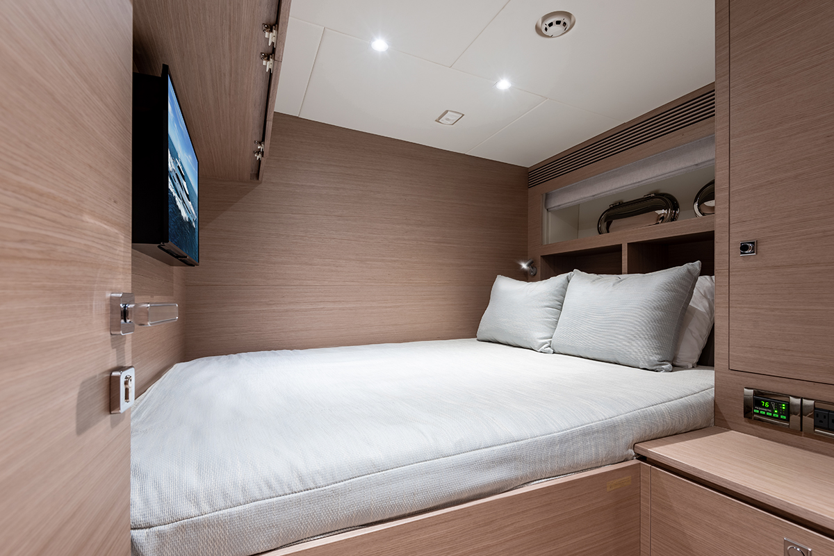 Spacious captains quarters with bed and TV. 