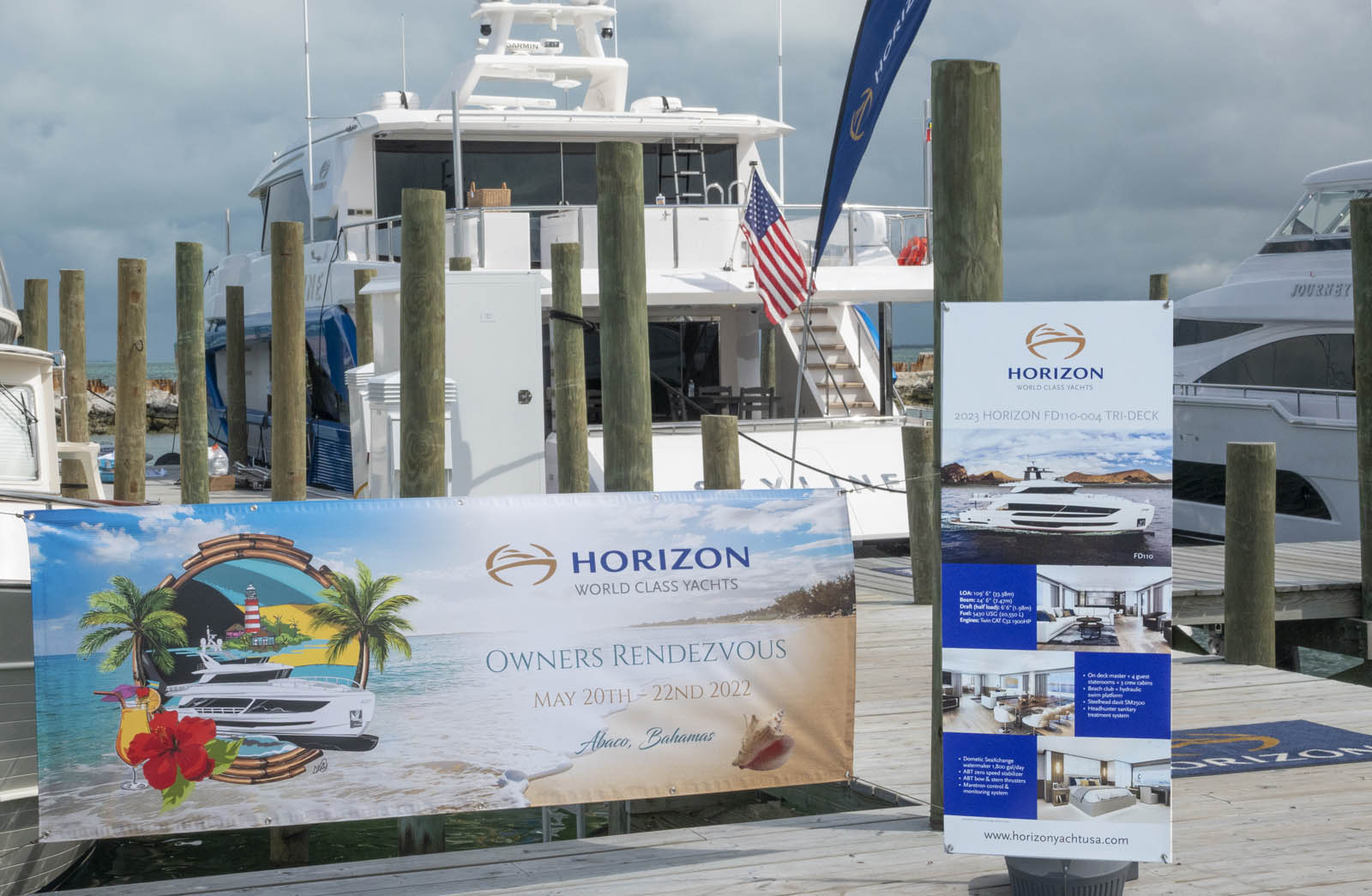 Horizon Yachts Rendezvous banner in the marina overlooking the ocean. 
